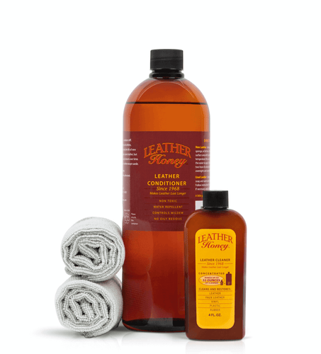 Large Leather Care Kit with conditioner, cleaner, and cloths for cleaning and conditioning leather goods.