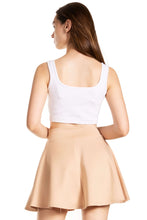 Load image into Gallery viewer, Back view of a woman wearing a beige flared mini skater skirt and white top, showcasing casual style and comfortable fit, made in USA.
