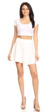 Load image into Gallery viewer, Woman wearing white flared casual mini skater skirt with stretchy material, Made in USA.
