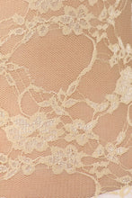 Load image into Gallery viewer, Close-up of delicate sheer floral lace fabric in beige, showcasing intricate lace pattern and texture, ideal for the tunic stretch tee.
