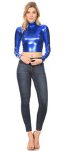 Charger l&#39;image dans la galerie, Metallic liquid blue mock neck turtleneck long sleeve crop top styled with jeans, highlighting shiny texture and modern fit.
