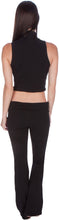 Load image into Gallery viewer, Back view of a woman wearing a black mock neck turtleneck sleeveless scuba crop top, paired with matching pants, showcasing chic style.
