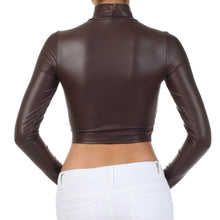 Load image into Gallery viewer, Back view of matte liquid mock neck turtleneck long sleeve crop top in dark brown, worn with white pants, showcasing sleek fit and design.
