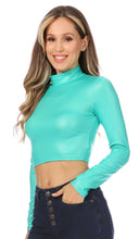 Load image into Gallery viewer, Matte liquid mock neck turtleneck long sleeve crop top in teal, modeled indoors. Made in USA fashion wear.
