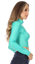Load image into Gallery viewer, Matte liquid mock neck turtleneck long sleeve crop top in teal, showcasing side view and fit. Made in USA fashion.
