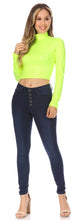 Load image into Gallery viewer, Neon green matte liquid mock neck turtleneck long sleeve crop top, paired with dark jeans and heels, modeled for style and fit.
