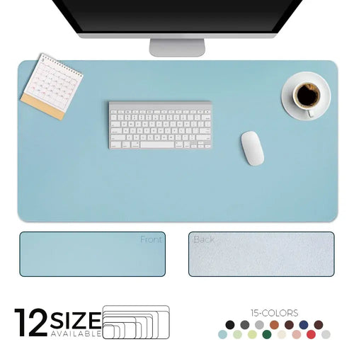 Stylish leather suede desk mat in blue with keyboard and coffee cup, available in 12 sizes and 15 colors for workspace enhancement.