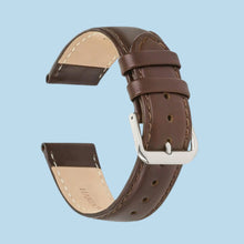 Load image into Gallery viewer, Brown leather watch band, 22mm, genuine Italian calfskin, semi-glossy finish, hand-stitched edges, silver buckle on blue background.
