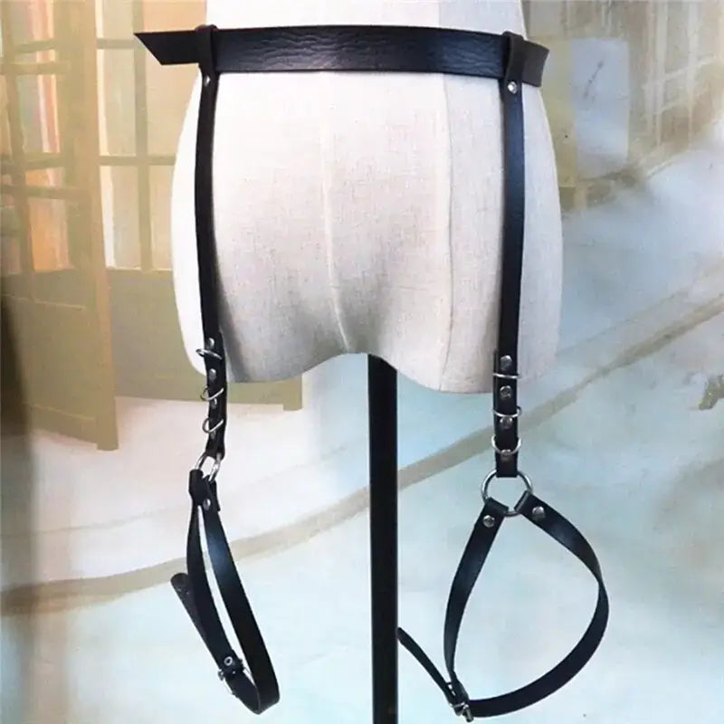 Black leather garters waist belt harness on mannequin, fashion accessory for bold style and confidence