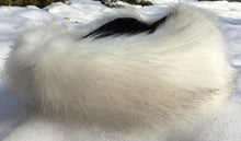 Charger l'image dans la galerie, Close-up of a fluffy white animal tail on a snowy background
