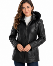 Load image into Gallery viewer, Woman wearing a black leather jacket with fur hood on a white background
