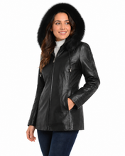 Load image into Gallery viewer, Woman wearing a black leather jacket with fur hood on a white background
