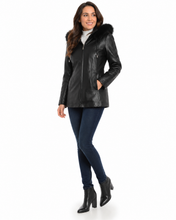 Load image into Gallery viewer, Woman wearing a black leather jacket with fur hood on a white background
