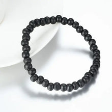 Load image into Gallery viewer, Black bead bracelet in a simple circular design for stylish wristwear.
