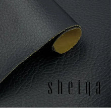 Load image into Gallery viewer, Close-up of black vegan leather repair patch for couches and car seats, showcasing textured surface and roll edge.
