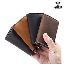 Cargar imagen en el visor de la galería, RFID Lock Vintage Automatic Leather Card Holder in brown and black vegan leather, shown in hand, featuring RFID blocking technology.
