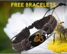 Cargar imagen en el visor de la galería, Bee bracelet with leather band on a daisy flower background with &#39;Free Bracelets&#39; text.
