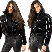 Load image into Gallery viewer, Woman wearing a shiny PU leather winter jacket, showcasing the sleek and glossy vegan leather finish and stylish design.
