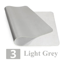 Load image into Gallery viewer, Light grey leather suede desk mat offering style and desk protection; ideal for enhancing workspace organization and comfort.
