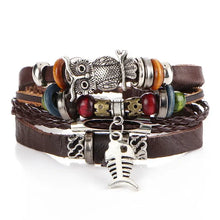 Load image into Gallery viewer, Multilayer leather bracelet with beads, owl and fish charms, showcasing rugged elegance and craftsmanship, perfect for any occasion.
