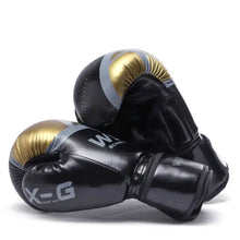 Load image into Gallery viewer, Black and gold adults kickboxing gloves with adjustable wrist strap and breathable design for training.
