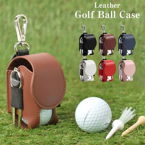 Leather golf ball pouch with snap closure, shown in various colors, next to a golf ball and tee on grass.