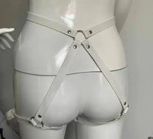 Load image into Gallery viewer, Back view of white PU leather garter belt harness on mannequin, showcasing stylish design and adjustable straps for seductive elegance.
