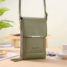 Load image into Gallery viewer, Green 2-in-1 leather bag on a table, transforms from handbag to crossbody; premium and versatile accessory for style and sophistication.
