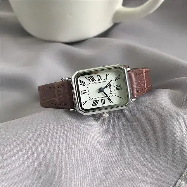 Retro Women's Classic Quartz Watch with Vegan Leather Strap on Grey Fabric Background