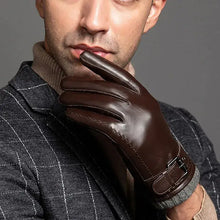 Load image into Gallery viewer, Man wearing stylish brown leather gloves, showcasing winter fashion and comfort.
