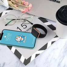 Load image into Gallery viewer, Apple Watch 5 band beside a smartphone on a desk with glasses and a coffee cup.
