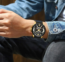 Load image into Gallery viewer, Person wearing Curren Chono Edition 2022 leather watch with gold accents, showcasing durability and style on the wrist.
