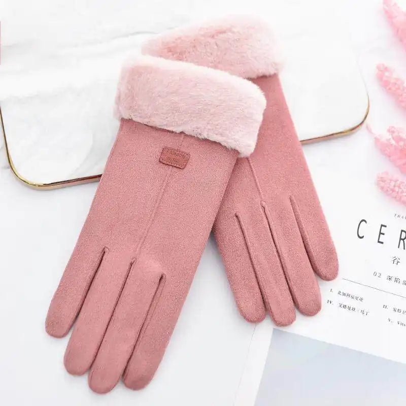 Pink plush winter gloves with soft lining for warmth and comfort.