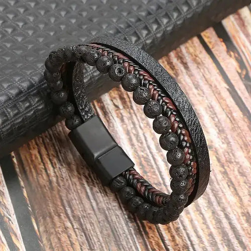 Classic men's leather bracelet with black and brown beads, showcasing stylish elegance and masculine confidence on a wooden surface.