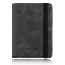 Load image into Gallery viewer, Leather RFID-blocking passport holder and travel wallet in black, offering stylish identity protection with secure card storage for travelers.

