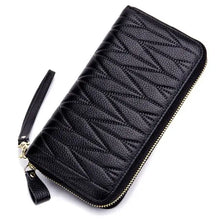 Load image into Gallery viewer, Elegant black leather female travel purse with zipper, designed for style and functionality, perfect for organizing essentials on the go.
