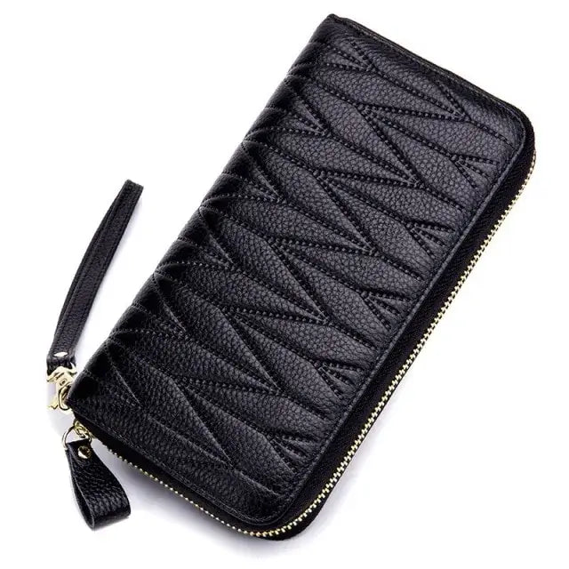 Elegant black leather female travel purse with zipper, designed for style and functionality, perfect for organizing essentials on the go.
