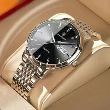 Load image into Gallery viewer, Men&#39;s stainless steel watch with sleek design on beige cushion.
