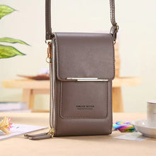 Load image into Gallery viewer, 2-in-1 Leather Bag transforming from handbag to crossbody, crafted from premium leather, showcasing style and versatility on a table.
