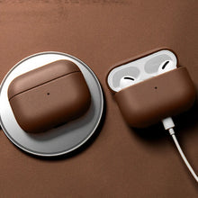 Load image into Gallery viewer, Genuine leather AirPods case in brown, featuring wireless charging and durable protection for AirPods.
