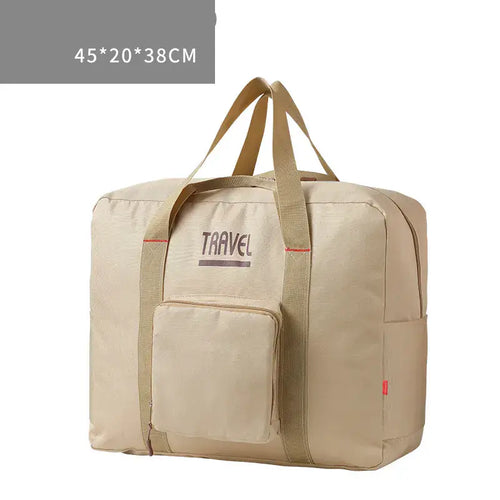 Large capacity foldable canvas travel bag in beige, designed for men and women, ideal for travel with convenient storage pocket.