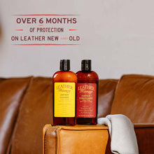 Load image into Gallery viewer, Leather Care Kit with cleaner and conditioner for leather protection on couch.
