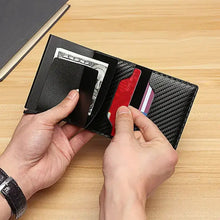 Load image into Gallery viewer, Sleek RFID black trifold leather wallet with cards and cash, showcasing its compact and functional design for everyday essentials.
