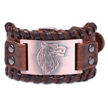 Load image into Gallery viewer, Vintage wide leather woven bracelet with intricately crafted wolf head centerpiece symbolizing strength and independence.
