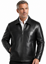 Load image into Gallery viewer, A man wearing a black leather jacket with a front zipper, stand-up collar, and zippered side pockets, photographed against a plain white studio background.
