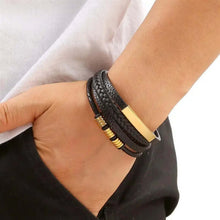 Load image into Gallery viewer, Classic men&#39;s leather bracelet with gold accents, worn with casual attire. Sophisticated and versatile style accessory for any occasion.
