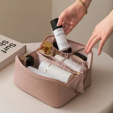 Load image into Gallery viewer, High-capacity leather cosmetic organizer with makeup compartments.
