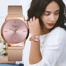 Load image into Gallery viewer, Woman wearing a trendy rose gold fashion watch with sleek design, adding elegance to her outfit.
