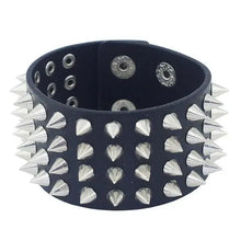 Load image into Gallery viewer, Bold faux leather bracelet with silver spikes for a punk-inspired look, perfect for adding edgy style to any fashion ensemble.

