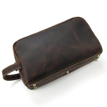 Load image into Gallery viewer, The Wanderer Toiletry Bag | Genuine Leather Toiletry Bag in dark brown leather, durable design with sturdy handle and metal feet.
